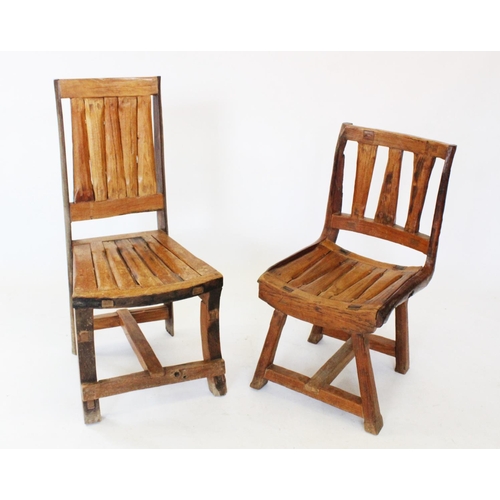 816 - A harlequin set of four driftwood patio or garden chairs, each chair with a substantial rail or spla... 