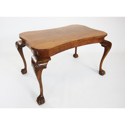 693 - A George II style burr walnut occasional table, circa 1930, the quarter veneered waisted rectangular... 