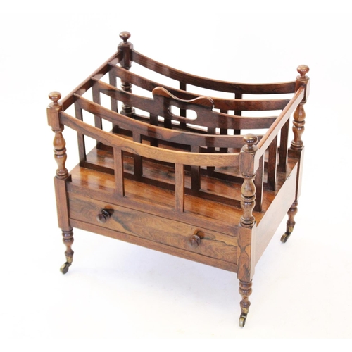 781 - A rosewood Canterbury, 19th century, of typical form with five curved division rails to the top, the... 