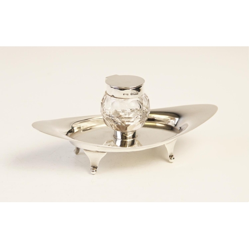 103 - An Edwardian silver and cut glass inkwell and stand by A & J Zimmerman Ltd, Birmingham 1904, the nav... 