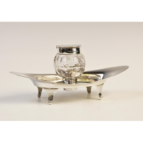 103 - An Edwardian silver and cut glass inkwell and stand by A & J Zimmerman Ltd, Birmingham 1904, the nav... 