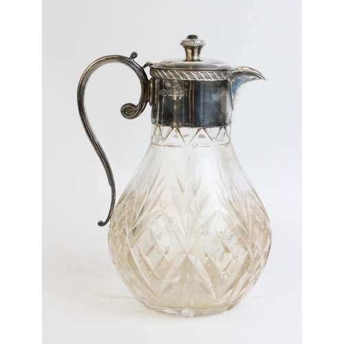 111 - A silver mounted cut glass claret jug by F G Flavell Ltd, Birmingham 1979, of baluster form with hin... 