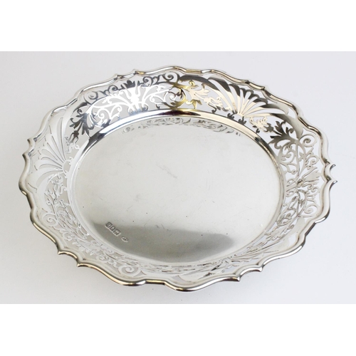 55 - An Edwardian silver bonbon dish by Sibray, Hall & Co Ltd, London 1909, with pierced decoration to pi... 