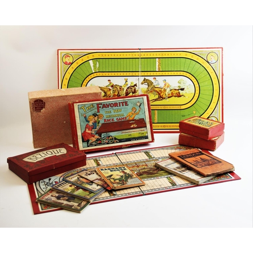 645 - A collection of vintage games and booklets, to include 'The Favorite' boxed mechanical race game, a ... 