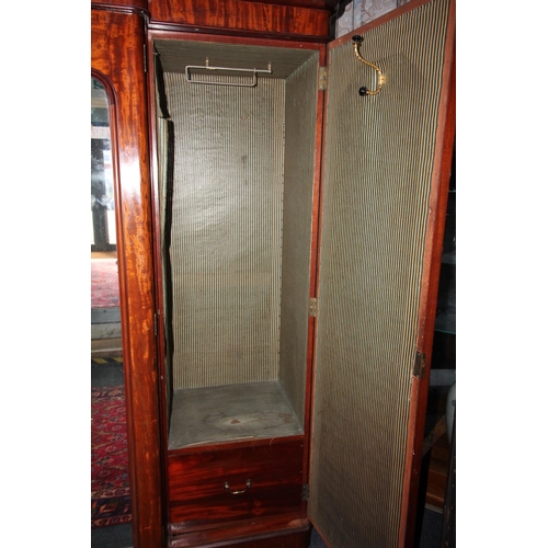 784 - A Victorian mahogany breakfront four door wardrobe, with a cavetto cornice above a pair of central m... 