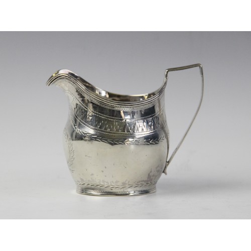 126 - A George III silver cream jug by John Merry, London 1804, of oval baluster form with engraved decora... 