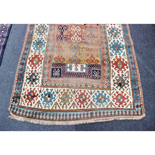 665 - A Bokhara type rug, with repeating octagonal medallions on a claret ground, 158cm x 90cm, along with... 