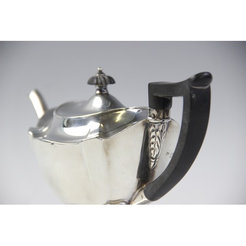 48 - An Edwardian silver teapot by Thomas Bradbury & Sons, London 1904, of shaped oval form on pedestal f... 