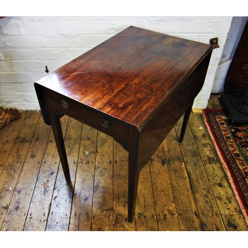 714 - An early 19th century mahogany Pembroke table, with a single frieze drawer opposed by a faux drawer,... 