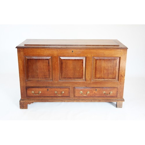 718 - A George III oak and mahogany cross banded mule chest, the rectangular moulded top above three inver... 