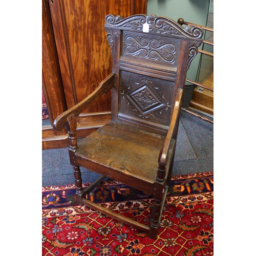 682 - A 17th century and later oak Wainscot chair, the carved pediment with scroll terminals above a panel... 