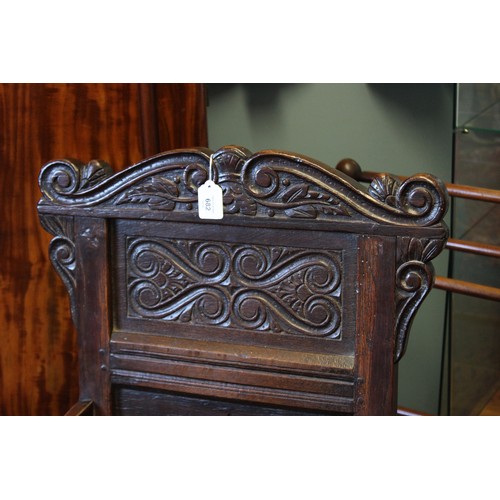 682 - A 17th century and later oak Wainscot chair, the carved pediment with scroll terminals above a panel... 