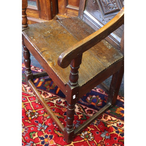 682 - A 17th century and later oak Wainscot chair, the carved pediment with scroll terminals above a panel... 