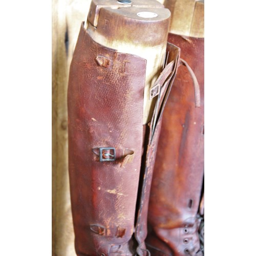 635 - A pair of early 20th century laced leather hunting boots, by Maxwell of London, with three buckle ga... 