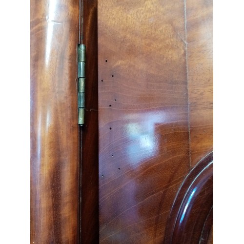 784 - A Victorian mahogany breakfront four door wardrobe, with a cavetto cornice above a pair of central m... 