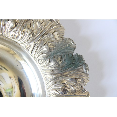 105 - A pair of George IV silver alms dishes by Samuel Hennell, London 1822 (g) and 1823 (h), each of circ... 