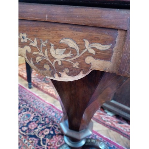 749 - A Victorian inlaid rosewood sewing table, of trumpet form, the octagonal hinged cover enclosing a sa... 