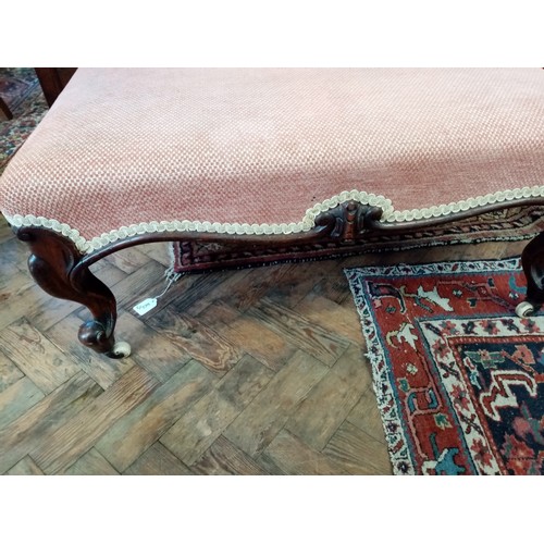 764 - A mid 19th century walnut and upholstered foot stool, the rectangular upholstered seat raised upon c... 