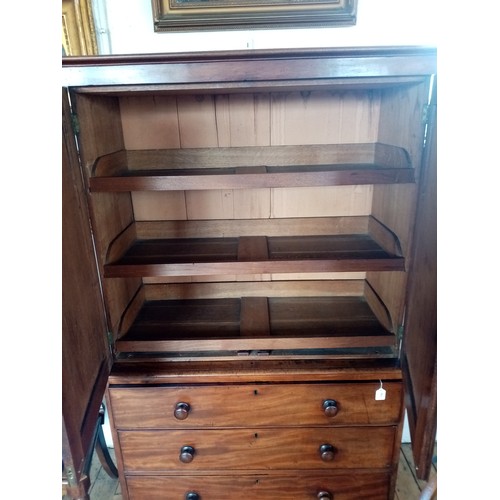 759 - A Victorian mahogany linen press of small proportions, the moulded cornice above two panelled doors ... 