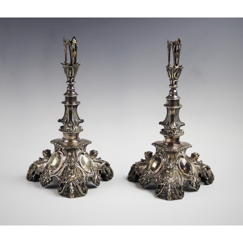 107 - A pair of silver plated candlesticks in the baroque revival style, mid 19th century, each with openw... 