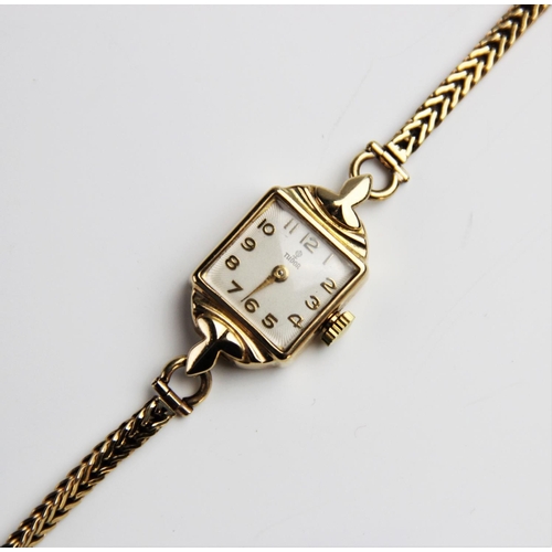 116 - A lady's vintage 9ct gold Tudor wristwatch, the square cream enamelled dial with engine turned decor... 