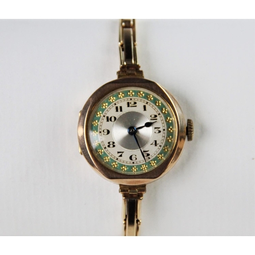 124 - A vintage 9ct gold lady's wristwatch, the round silvered dial with engine turned decoration and Arab... 