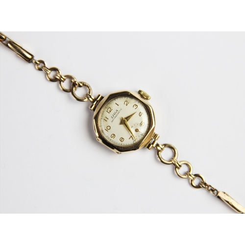 129 - A vintage 9ct gold Liga lady's wristwatch, the circular white dial with Arabic numerals and subsidia... 