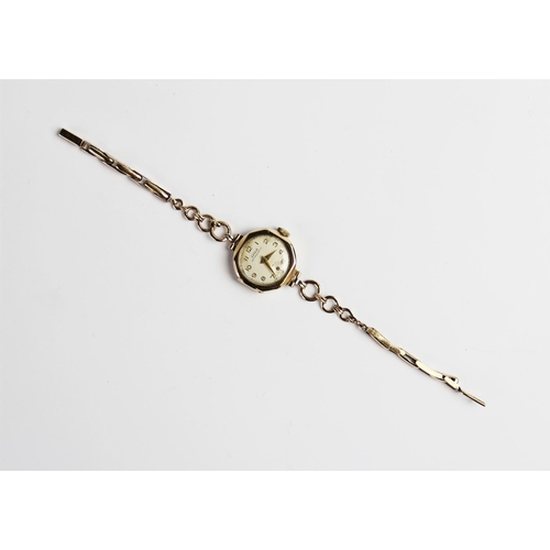 129 - A vintage 9ct gold Liga lady's wristwatch, the circular white dial with Arabic numerals and subsidia... 