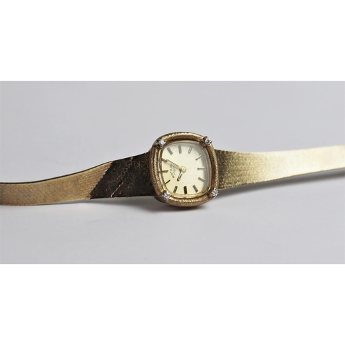 132 - A lady's vintage 9ct gold Rotary wristwatch, the square  gold toned dial with baton markers, set to ... 