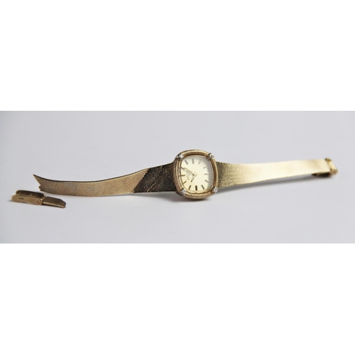 132 - A lady's vintage 9ct gold Rotary wristwatch, the square  gold toned dial with baton markers, set to ... 