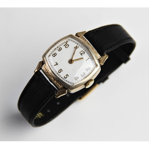 146 - A vintage wristwatch, the white enamel dial with gold toned Arabic numerals and outer seconds track,... 