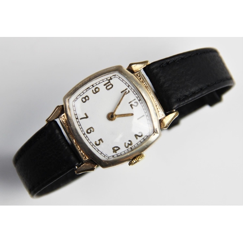 146 - A vintage wristwatch, the white enamel dial with gold toned Arabic numerals and outer seconds track,... 