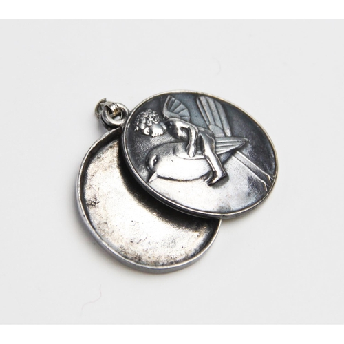 166 - A silver coloured locket pendant in the manner of Berthold Loffler for Wiener Werkstatte, of oval fo... 