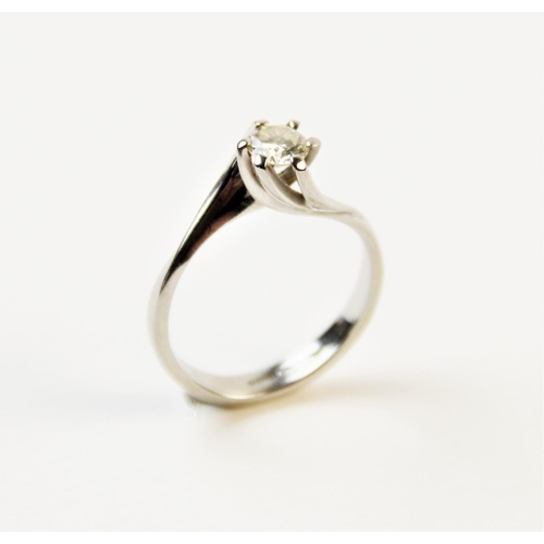 180 - A diamond solitaire ring, comprising a central round brilliant cut diamond weighing an estimated 0.2... 