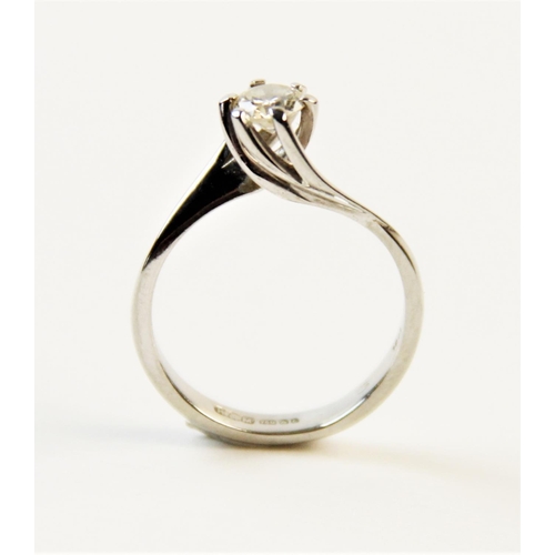 180 - A diamond solitaire ring, comprising a central round brilliant cut diamond weighing an estimated 0.2... 