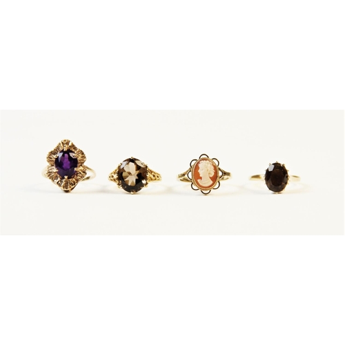 185 - A 9ct gold amethyst set dress ring, comprising a central oval cut amethyst measuring 10mm x 8mm, cla... 