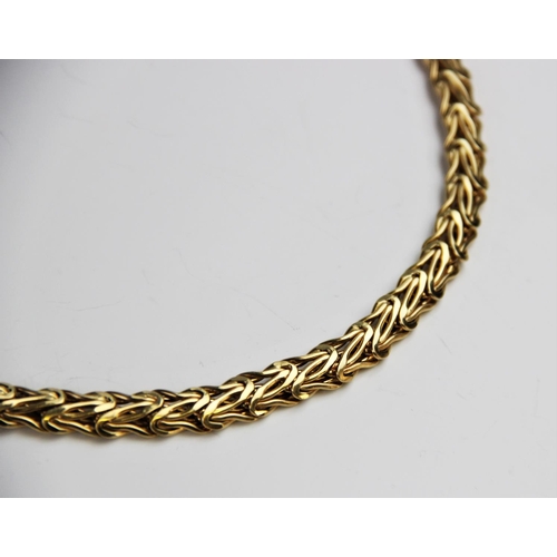 191 - An 18ct gold collarette and bracelet by UnoAErre, the woven link collarette with lobster claw fasten... 