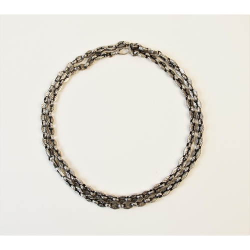 199 - A Victorian style white metal chain, comprising alternating hexagonal and circular links, each engra... 