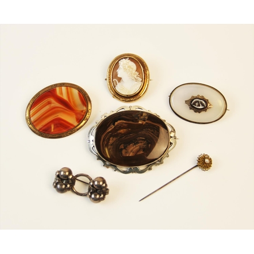 200 - A selection of Victorian and later brooches and pins, to include an oval chalcedony example with a c... 