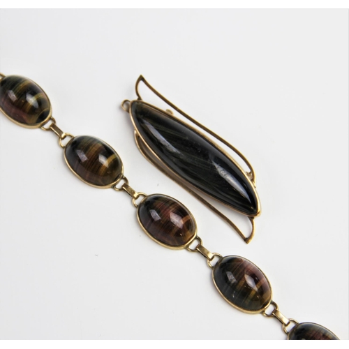 210 - A 9ct gold tiger's eye bracelet, comprising six oval polished tiger's eye cabochons, each measuring ... 