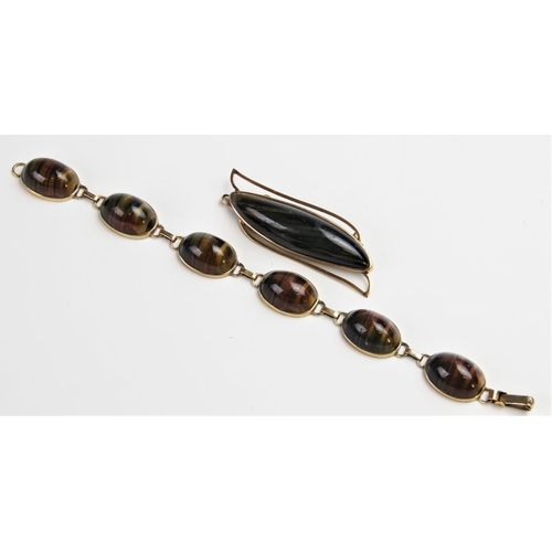 210 - A 9ct gold tiger's eye bracelet, comprising six oval polished tiger's eye cabochons, each measuring ... 