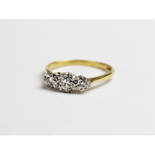 215 - A diamond three-stone ring, the central round brilliant cut diamond measuring an estimated 0.25 cara... 