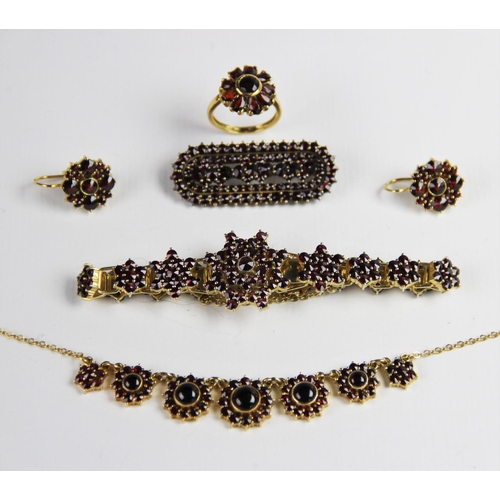 222 - A suite of Bohemian garnet set silver gilt jewellery, to include a pair of floral cluster drop earri... 