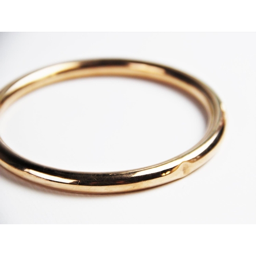 224 - A 9ct gold tubular slave bangle by S Ward & Sons, Chester 1920, 9cm diameter, weight 16.7gms