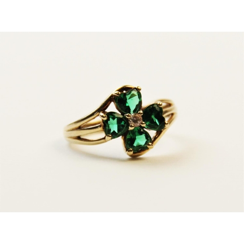 253 - A paste set 9ct gold four-leaf clover ring, the central cluster comprising four heart-shaped green p... 