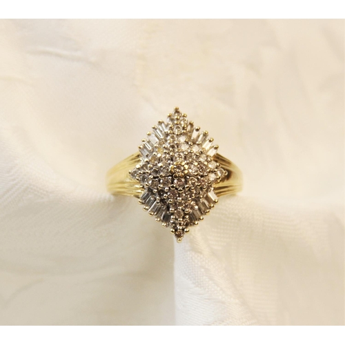 254 - A diamond 14ct gold cluster ring, the tiered marquise shaped cluster comprising forty-one round bril... 