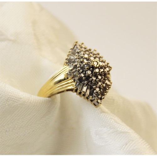 254 - A diamond 14ct gold cluster ring, the tiered marquise shaped cluster comprising forty-one round bril... 