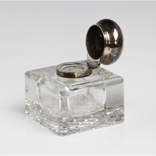 26 - A late Victorian silver mounted cut glass inkwell by George Bedingham, London 1899, of compressed cu... 
