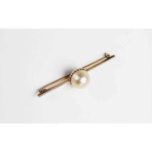 268 - An untested pearl set brooch, the central pearl (measuring approximately 12mm diameter) within a yel... 