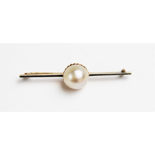 268 - An untested pearl set brooch, the central pearl (measuring approximately 12mm diameter) within a yel... 